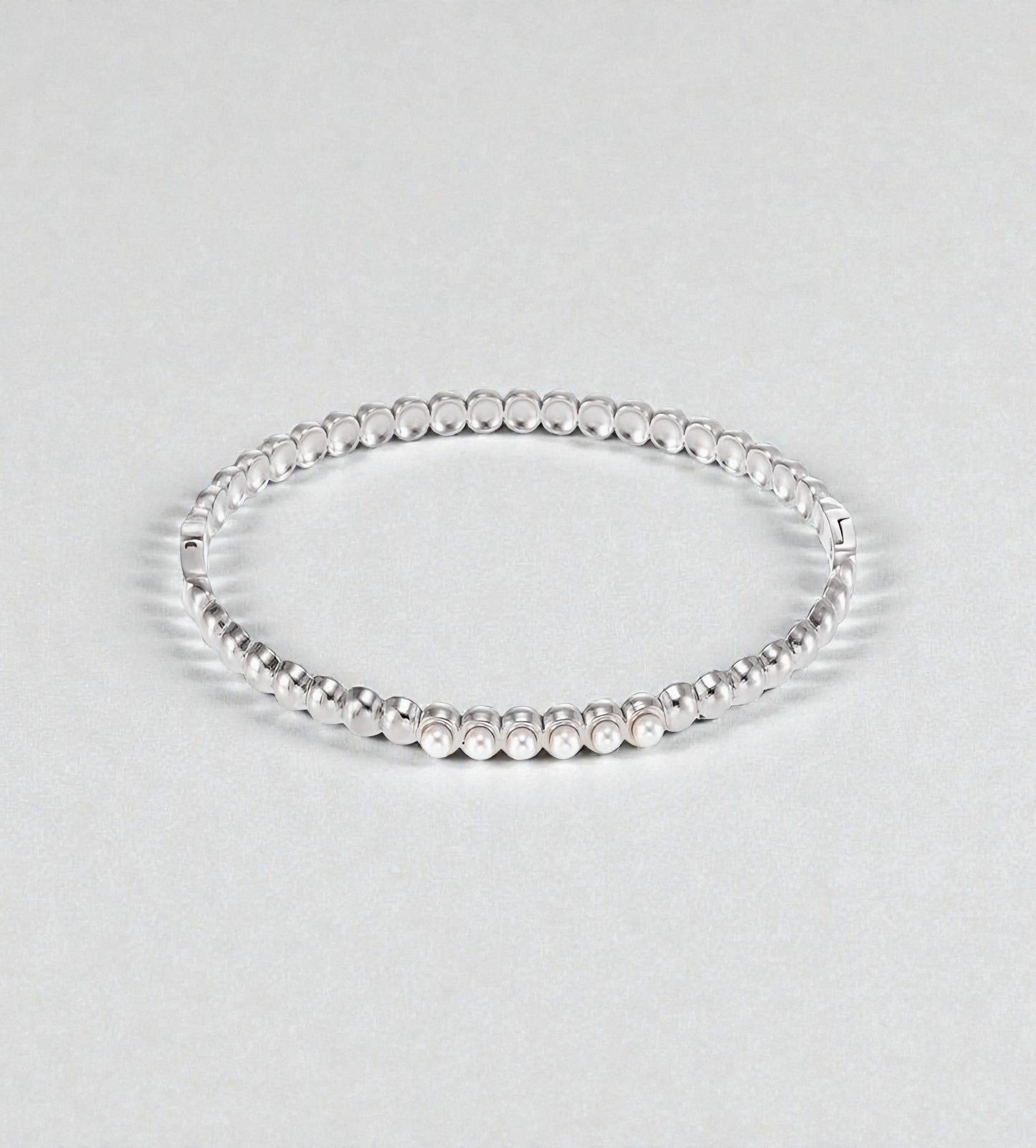 Bracelet doré élastique avec perles de nacre